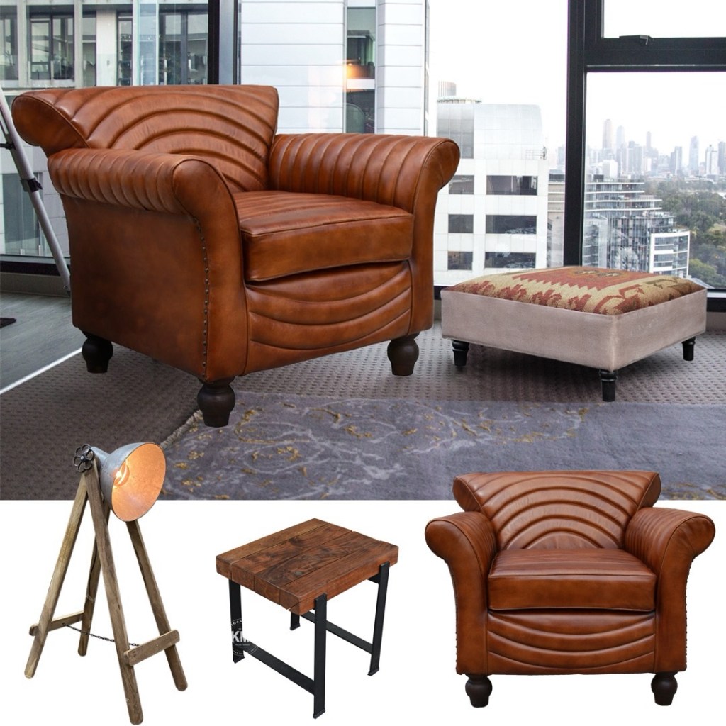 Fotel loftowy ze skóry naturalnej w ciepłym brązowym odcieniu z przeszyciami, w nowoczesnym apartamencie z widokiem na miasto